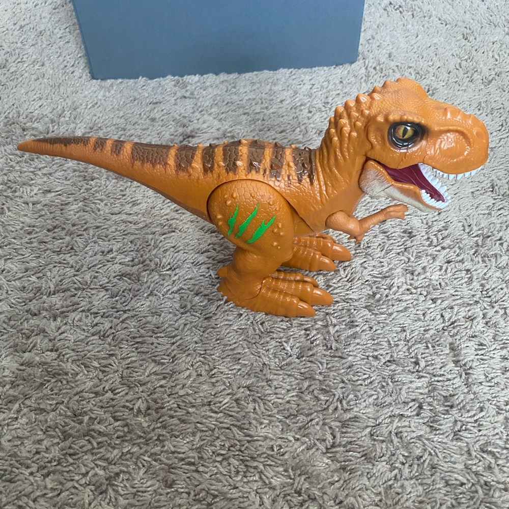 Orange Dinosaur Action Figure with Green Accents